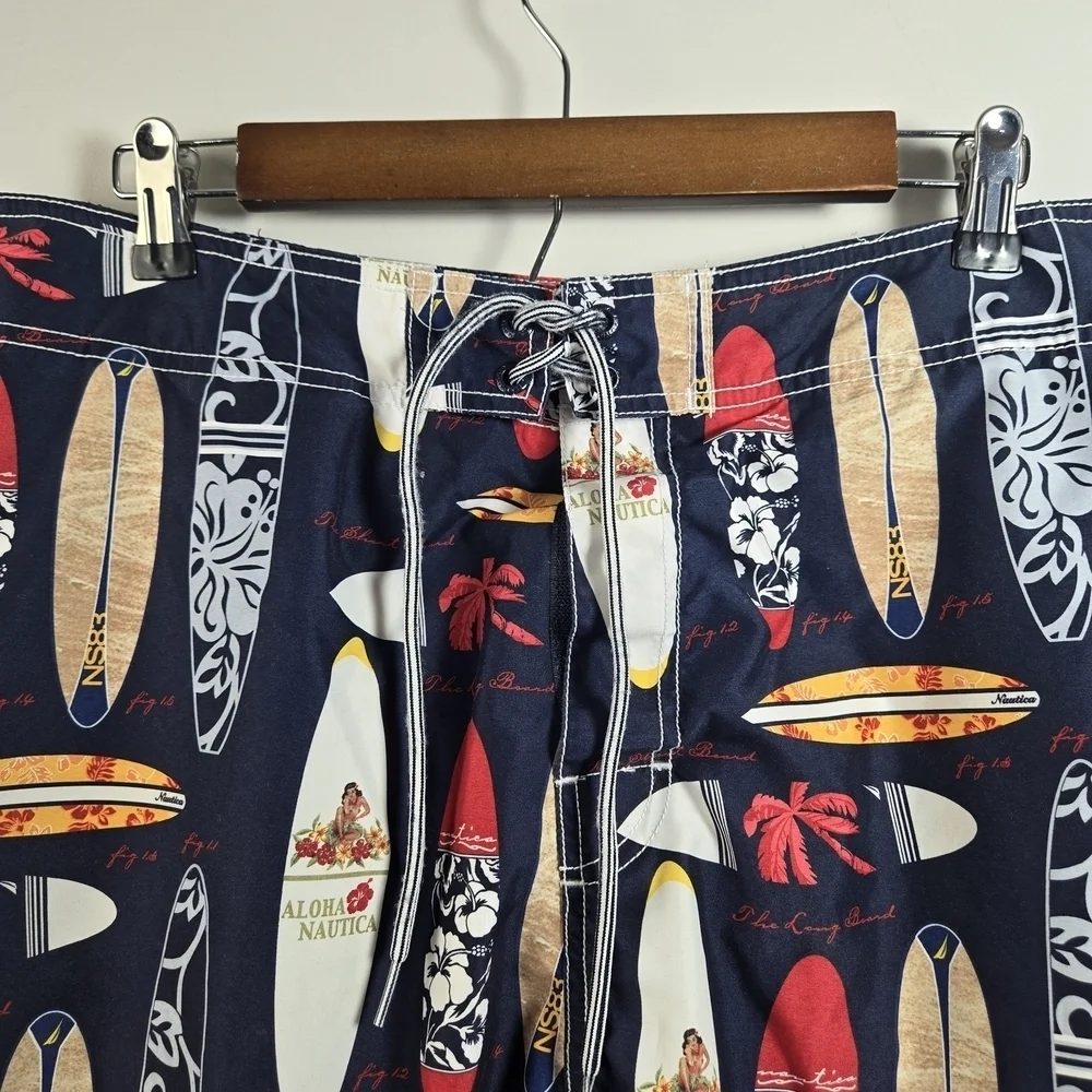 Nautica Blue and Red Swim Trunks with Surfboard Design